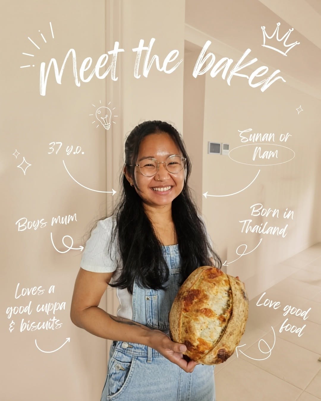 Nam, the baker behind Little Loaf Sourdough, smiling and holding a freshly baked loaf
